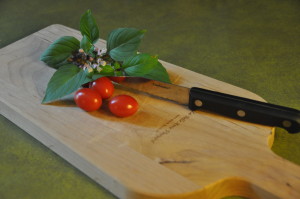 You can use ingredients you have grown at home, too! Pictured: Fresh basil and cherry tomatoes